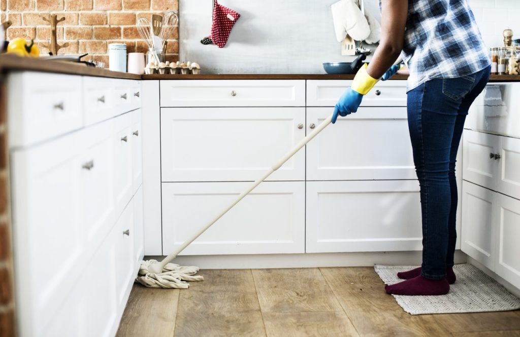 lady cleaning kitchen