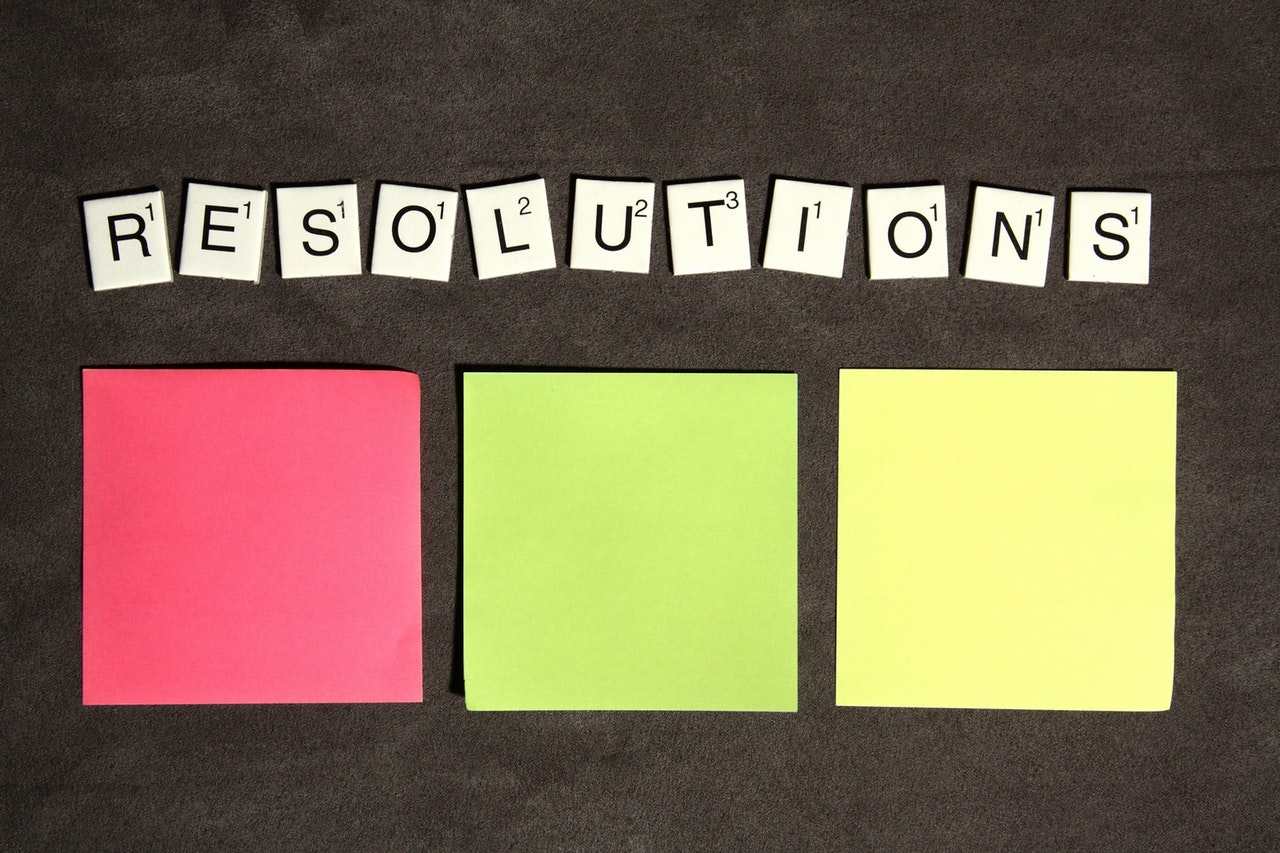 Scrabble tiles spelling “resolutions”