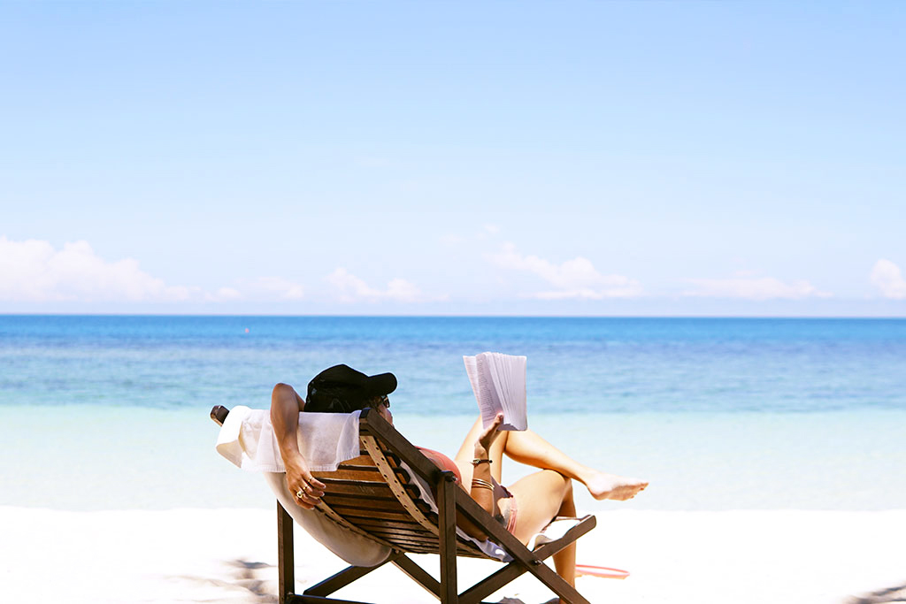 Women reading in the beach